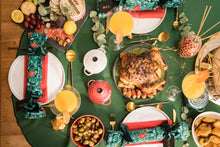 Load image into Gallery viewer, Luxury xmas crackers on a Christmas table with a roasted turkey
